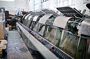 Printing, factory and paper machine at production facility for distribution, publishing or manufacturing. Workshop