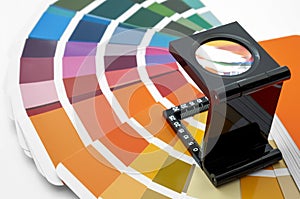Printing loupe used to examine colour chart concept for color check, analyze quality of output colours of printing and magnifying