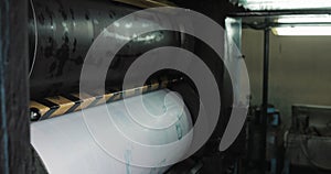 Printing machine. Large paper roll print machine in production