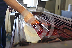 Printing machine. The printer applies ink inks. The printing process