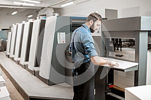 Printing operator working at the manufacturing