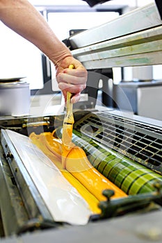 The printing process. The printer applies ink inks