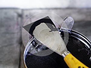 Printmaking tool in art studio.