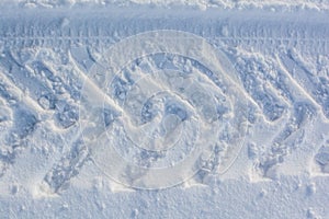 Prints of wheels on a snow
