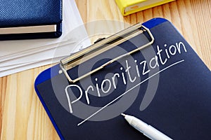 Prioritization handwritten sign on the page