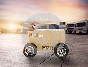 Priority Cardboard box with racing wheels like a car. Fast shipping by road.