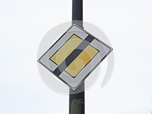 Priority road end sign