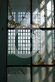 Prison: broken glass steel windows v