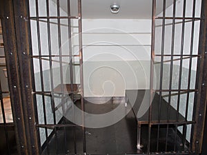 Prison cells all closed jail cell with welded iron bars