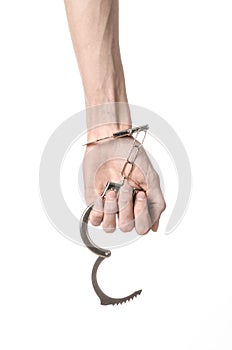 Prison and convicted topic: man hands with handcuffs isolated on