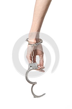 Prison and convicted topic: man hands with handcuffs isolated on photo