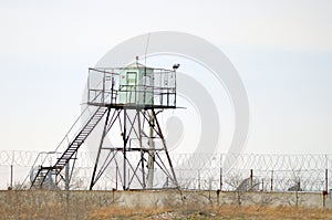 Prison fence and guard tower. Russia. Siberia