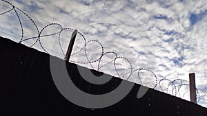 Prison fence with metal barbed wire 4K video footage