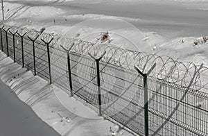 Prison fence in winter time