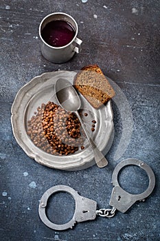 Prison food and handcuff above