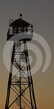 Prison guard watch tower at dusk