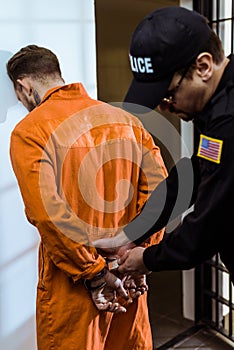 prison guard wearing handcuffs