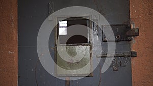 Prison Metal Door Protect Prisoner From Inside to Escape. Food Channel Through Prison Cells Bars. Jail, Detail of Confinement and