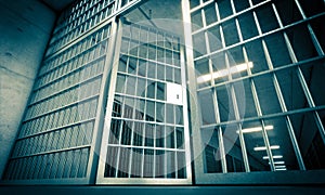 Prison in penitentiary with bars and open door