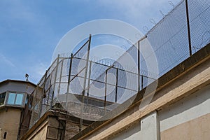 Prison wall, bottom view photo