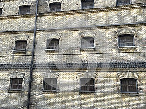 Prison wall, bars on the windows