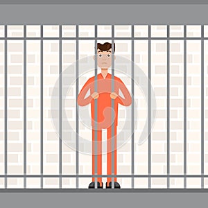The prisoner behind bars. Convict inside jail