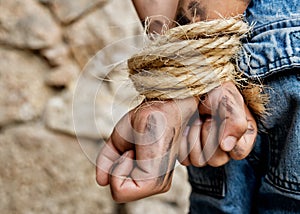 Prisoner bound with rope photo