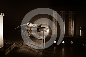 Prisoner handcuffed to death by lethal injection, vial with sodium thiopental and syringe on top of a table, conceptual image