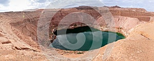 Pristine natural beauty of the deep blue Hidden Lake near the Timna park,surrounded by mountains near Eilat city, Arava Valley,
