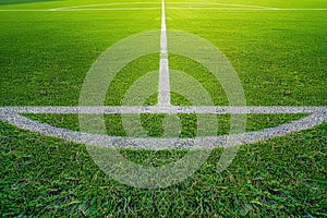 Pristine Soccer Field with Immaculate Grass and Central Line Under Bright Sunlight