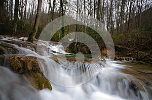 Pristine waterfalls in the forest in spring