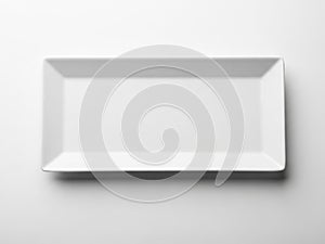 A pristine white rectangular plate against a plain background
