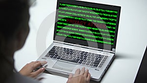 Privacy attack on laptop computer, woman working in office, cybercrime, close up