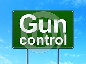 Privacy concept: Gun Control on road sign background