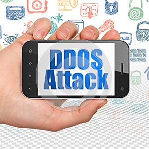 Privacy concept: Hand Holding Smartphone with DDOS Attack on display