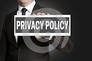 Privacy Policy sign is held by businessman photo