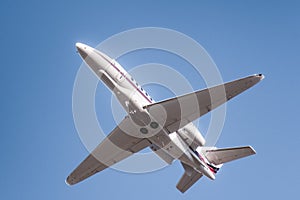 Private airplane ascending after take off from an airport in California