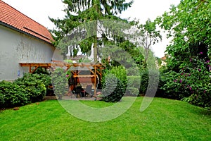 Backyard garden idyll in summer by green nature photo