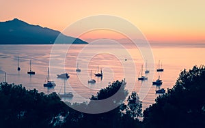 Private boats and small yachts anchored in a quiet bay in the It