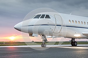 Private business jet with sunrise