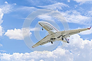 Private business plane flying under blue sky