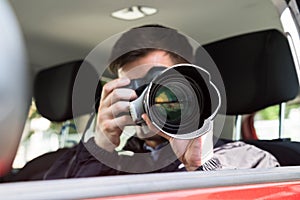 Private Detective Photographing With Slr Camera