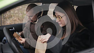 A private detective sat in the car to the woman and gives her information about the investigation of her husband, a