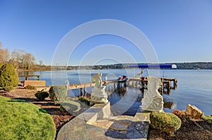 Private dock with jet ski lifts and covered boat lift, Lake Washington.