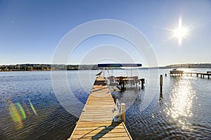 Private dock with jet ski lifts and covered boat lift, Lake Washington.