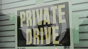 private drive caption text writing sign taped to window with closed blinds-