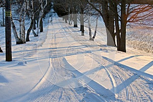 Private drive in countryside covered with snow