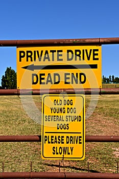 Private Drive and Dog sign in a western setting