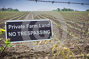 `Private Farm Land No Trespassing` sign