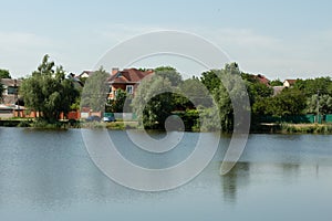 Private houses over a lake in the forest